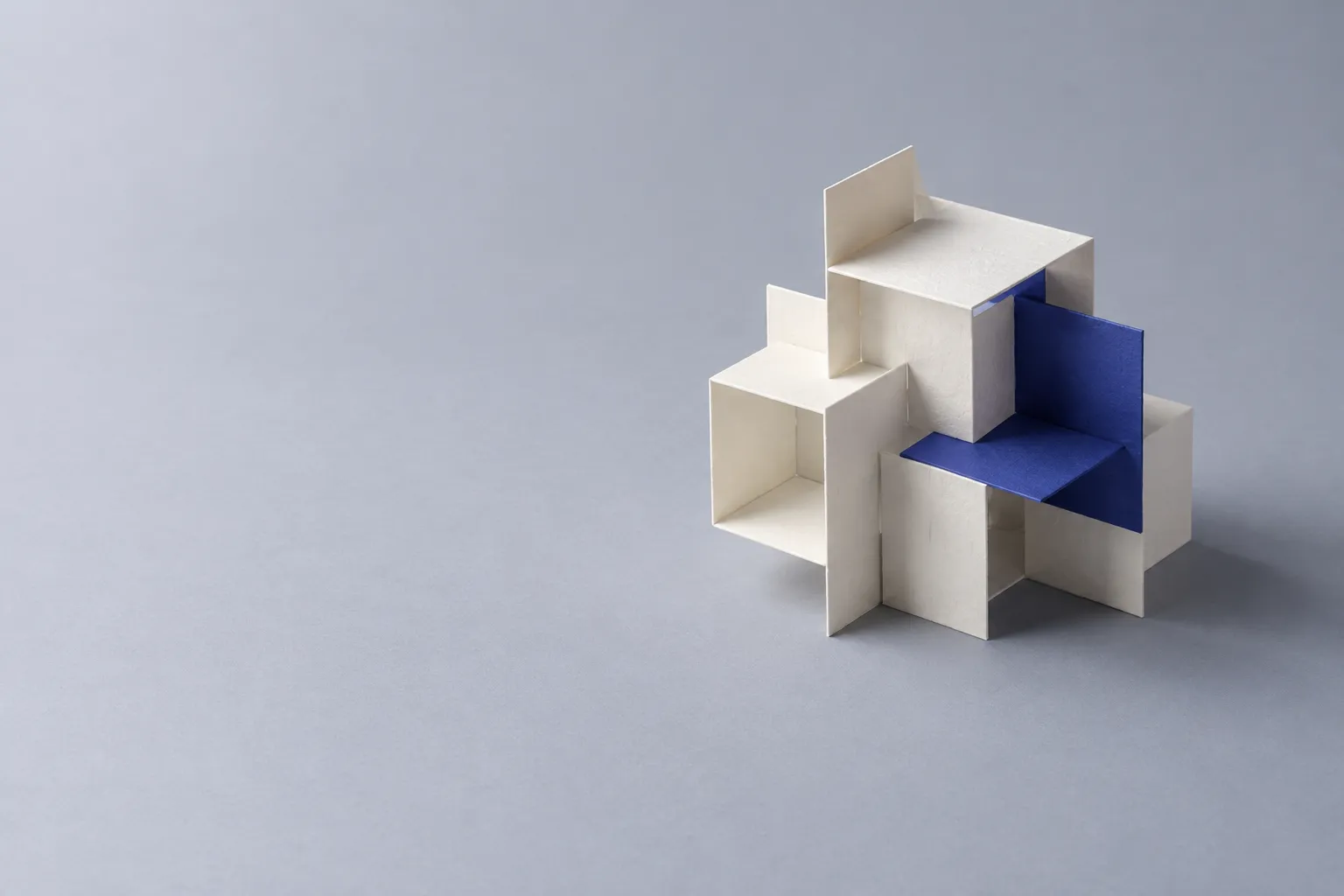 Modular folded paper units interlocking into one ordered structure